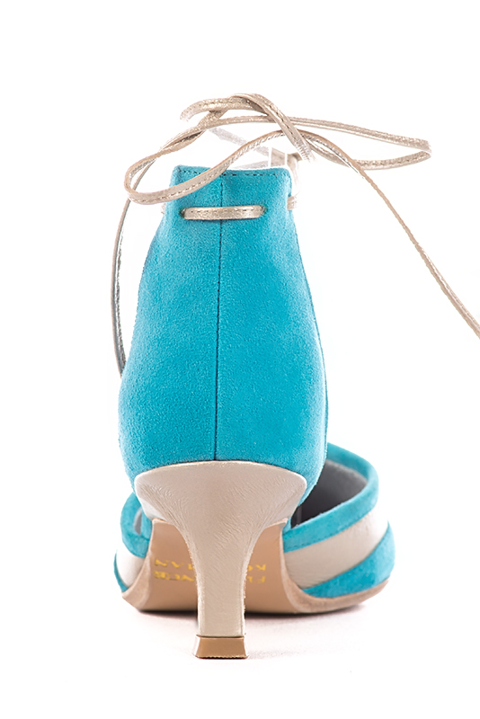 Turquoise blue and gold women's open side shoes, with lace straps. Pointed toe. Medium spool heels. Worn view - Florence KOOIJMAN